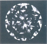 Fig 74 Several very small, light inclusions under the crown facets 